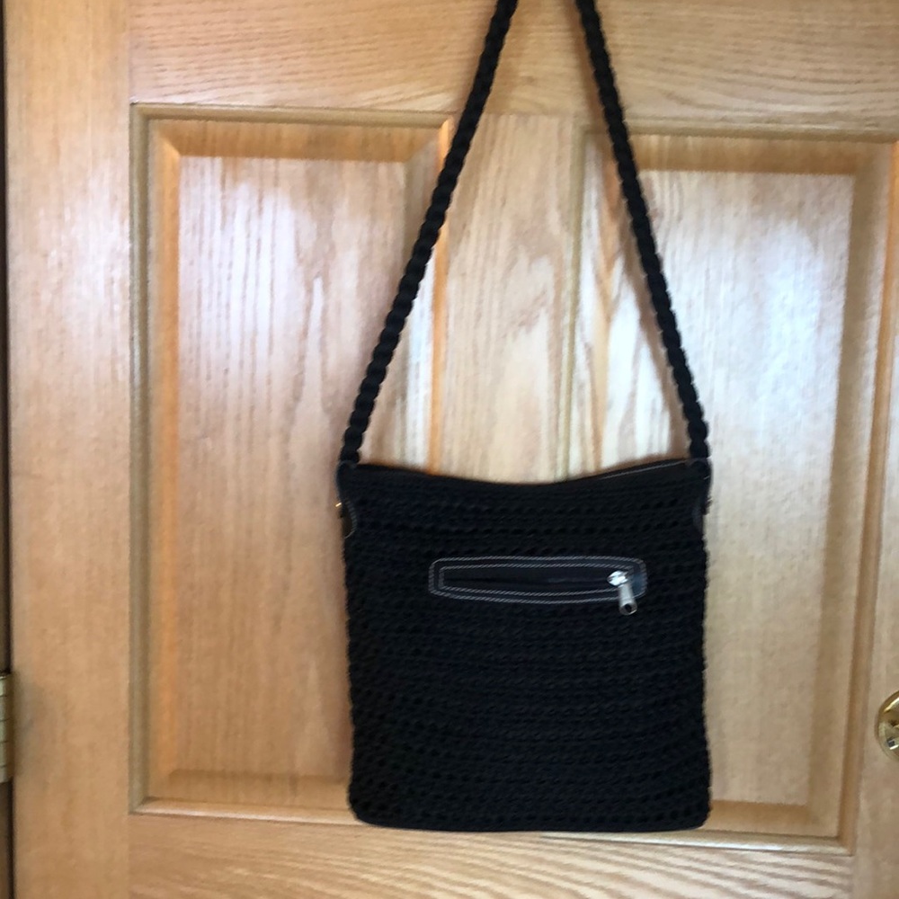 Lucy shoulder or crossbody. Woven with leather accents.